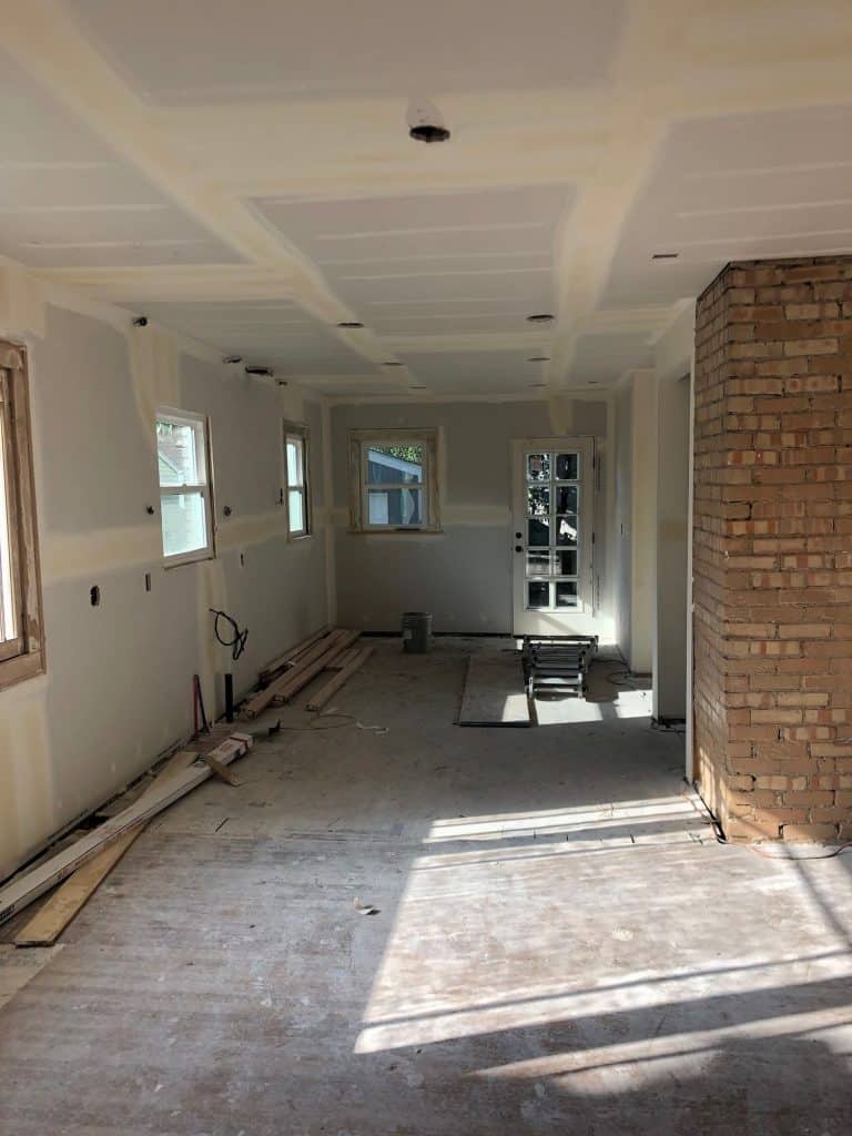 Harrison Avenue New sheetrock kitchen and LR - exposed brick of chimney